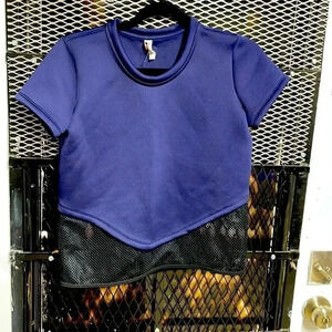 Woman’s Under Armour shirt navy and black see through bottom.
